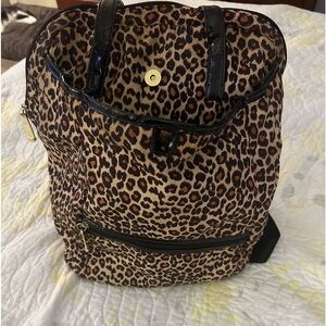 Betsy Johnson leaped back back with hand straps